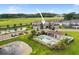 An aerial view of the townhomes and community pool surrounded by lush landscaping at 5496 Riverwalk Preserve Dr, New Port Richey, FL 34653