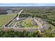 Beautiful aerial view of community highlighting the pool, pond, well maintained green scenery at 5496 Riverwalk Preserve Dr, New Port Richey, FL 34653
