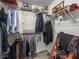Walk-in closet with shelving and hanging space for organized storage at 5496 Riverwalk Preserve Dr, New Port Richey, FL 34653