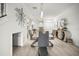 Open-concept dining room with modern decor, stylish furniture, and neutral color palette at 5496 Riverwalk Preserve Dr, New Port Richey, FL 34653