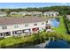 Enjoy pond views from this home with a patio and colorful landscaping at 5496 Riverwalk Preserve Dr, New Port Richey, FL 34653