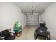 Tidy garage featuring an automatic door opener and ample storage space at 5496 Riverwalk Preserve Dr, New Port Richey, FL 34653