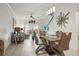 Inviting living area with modern decor and a sliding glass door to the outside patio at 5496 Riverwalk Preserve Dr, New Port Richey, FL 34653