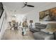 Spacious living room with combined dining area, comfortable seating, and modern decor throughout at 5496 Riverwalk Preserve Dr, New Port Richey, FL 34653