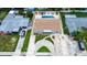 This property boasts a private pool, well-manicured lawn, and circular driveway, creating an inviting outdoor space at 5672 62Nd N Way, St Petersburg, FL 33709