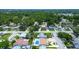 An aerial neighborhood shot showing a single-Gathering home with a private pool and well-maintained landscaping at 5672 62Nd N Way, St Petersburg, FL 33709