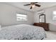 Bedroom with a patterned bedspread, ceiling fan, window, and dresser at 5672 62Nd N Way, St Petersburg, FL 33709