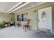 Relax on this charming front porch with two wicker chairs and ample room to spare at 5672 62Nd N Way, St Petersburg, FL 33709