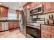 Modern kitchen boasts stainless steel appliances and dark countertops at 5672 62Nd N Way, St Petersburg, FL 33709