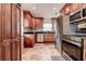 Well-equipped kitchen with stainless steel appliances and rich wood cabinetry at 5672 62Nd N Way, St Petersburg, FL 33709