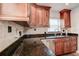 Beautiful kitchen showcases a stainless steel sink, stainless appliances, and granite countertops at 5672 62Nd N Way, St Petersburg, FL 33709
