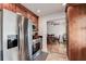 Modern kitchen features stainless steel appliances and warm, inviting wood cabinetry at 5672 62Nd N Way, St Petersburg, FL 33709