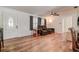 Bright living room features wood floors, ceiling fan, and comfortable leather reclining sofa at 5672 62Nd N Way, St Petersburg, FL 33709
