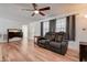 Inviting living room boasts a ceiling fan, wood floors, and modern decor at 5672 62Nd N Way, St Petersburg, FL 33709