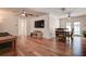 Bright living room featuring hardwood floors, modern ceiling fans, and plenty of natural light at 5672 62Nd N Way, St Petersburg, FL 33709