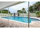 Sparkling pool with patio and shed under sunny skies at 5672 62Nd N Way, St Petersburg, FL 33709
