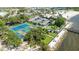 Aerial view features tennis courts, a beach and community recreation area by the water at 611 Destiny Dr # 204, Ruskin, FL 33570