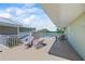 A large balcony features seating areas with views of the water and recreation areas at 611 Destiny Dr # 204, Ruskin, FL 33570