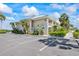 Condo building with lush tropical landscaping, ample parking, and waterfront access at 611 Destiny Dr # 204, Ruskin, FL 33570