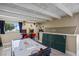 This game room includes an air hockey table, ping pong, and arcade games, perfect for entertaining guests at 611 Destiny Dr # 204, Ruskin, FL 33570