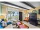 Studio unit featuring a sofa and a view of palm trees and the ocean at 611 Destiny Dr # 204, Ruskin, FL 33570