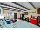 Open concept studio featuring a sofa and kitchenette with beamed ceiling at 611 Destiny Dr # 204, Ruskin, FL 33570