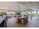 Outdoor patio with wicker furniture and scenic views, perfect for relaxing or entertaining guests at 611 Destiny Dr # 204, Ruskin, FL 33570