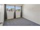 Bright bedroom with gray carpet and large windows providing plenty of natural light at 6132 7Th S Ave, Gulfport, FL 33707
