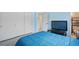 Bedroom features a comfortable bed, closet, and a flatscreen TV, offering a cozy and relaxing retreat at 6132 7Th S Ave, Gulfport, FL 33707
