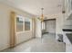 Bright dining room featuring large windows and modern lighting, creating an inviting atmosphere for meals at 6132 7Th S Ave, Gulfport, FL 33707