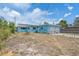Charming blue single-Gathering home with a fenced yard, two-car garage, and well lit windows at 6132 7Th S Ave, Gulfport, FL 33707