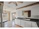 Kitchen featuring white cabinetry, countertops, and a seamless connection to the dining area, creating a cohesive living space at 6132 7Th S Ave, Gulfport, FL 33707