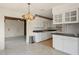 Kitchen boasts white cabinetry, dark countertops, and modern appliances, seamlessly blending functionality with style at 6132 7Th S Ave, Gulfport, FL 33707