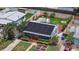 Aerial view of the home with solar panels, backyard deck and fire pit at 6183 5Th S Ave, St Petersburg, FL 33707