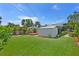 Backyard with a shed, deck, and a fire pit at 6183 5Th S Ave, St Petersburg, FL 33707