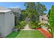 A green backyard with a stone path at 6183 5Th S Ave, St Petersburg, FL 33707