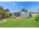 Wide backyard with a shed and a wood deck at 6183 5Th S Ave, St Petersburg, FL 33707