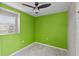 Bedroom featuring a bright green wall, tile floors and natural light at 6183 5Th S Ave, St Petersburg, FL 33707