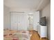 Spacious bedroom with hardwood floors and access to the hallway, great for relaxation and privacy at 6269 Palma Del Mar S Blvd # 306, St Petersburg, FL 33715