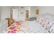 Well-lit bedroom showcases a floral-patterned bed, white walls and wicker furniture, creating a calm and inviting space at 6269 Palma Del Mar S Blvd # 306, St Petersburg, FL 33715