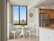 Bright breakfast nook adjacent to kitchen, offering a cozy space for casual meals with a pleasant view at 6269 Palma Del Mar S Blvd # 306, St Petersburg, FL 33715