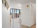 Hallway view of dining area with balcony access, creating a seamless transition between indoor and outdoor spaces at 6269 Palma Del Mar S Blvd # 306, St Petersburg, FL 33715