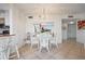 Charming dining area with chandelier, seamlessly connecting to kitchen for easy entertaining and Gathering meals at 6269 Palma Del Mar S Blvd # 306, St Petersburg, FL 33715