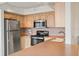 Efficient kitchen featuring modern appliances, practical layout, and abundant storage for a seamless cooking experience at 6269 Palma Del Mar S Blvd # 306, St Petersburg, FL 33715