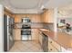 Functional kitchen with stainless steel appliances, ample cabinetry, and a practical design for easy meal preparation at 6269 Palma Del Mar S Blvd # 306, St Petersburg, FL 33715