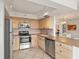 Well-equipped kitchen featuring stainless steel appliances, ample cabinetry, and a functional layout for culinary enthusiasts at 6269 Palma Del Mar S Blvd # 306, St Petersburg, FL 33715