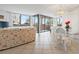 Bright living area with large windows and access to balcony, seamlessly connected to dining space for easy living at 6269 Palma Del Mar S Blvd # 306, St Petersburg, FL 33715