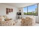 Bright living room with large windows offering scenic views and comfortable seating, perfect for relaxation at 6269 Palma Del Mar S Blvd # 306, St Petersburg, FL 33715