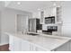 Bright kitchen with white cabinetry, stainless steel appliances, and marble countertops at 700 S Harbour Island Blvd # 731, Tampa, FL 33602