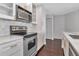 Updated kitchen with white cabinets, stainless steel appliances, and marble backsplash at 700 S Harbour Island Blvd # 731, Tampa, FL 33602